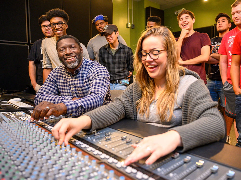 Jamar Jones, left, and students from the record label studio management class.