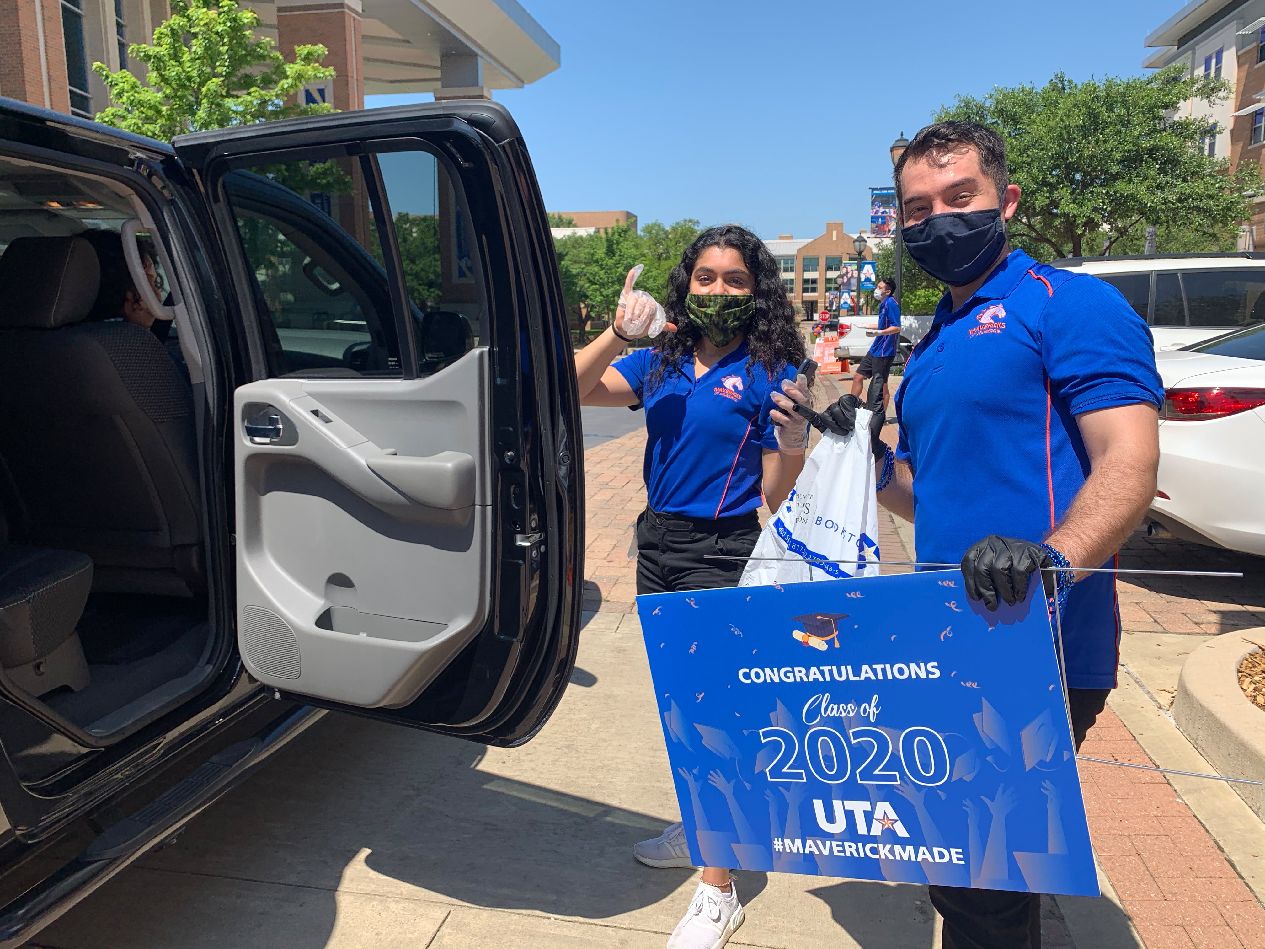 Students at drive-thru event May 2020" width="4032" _languageinserted="true" src="https://cdn.web.uta.edu/-/media/project/website/news/releases/2020/05/drive-thru1.ashx?la=en