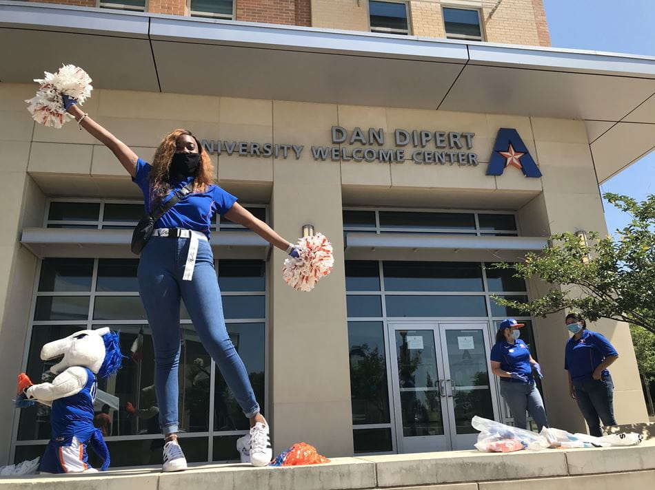 UTA student wearing mask outside of Welcome Center