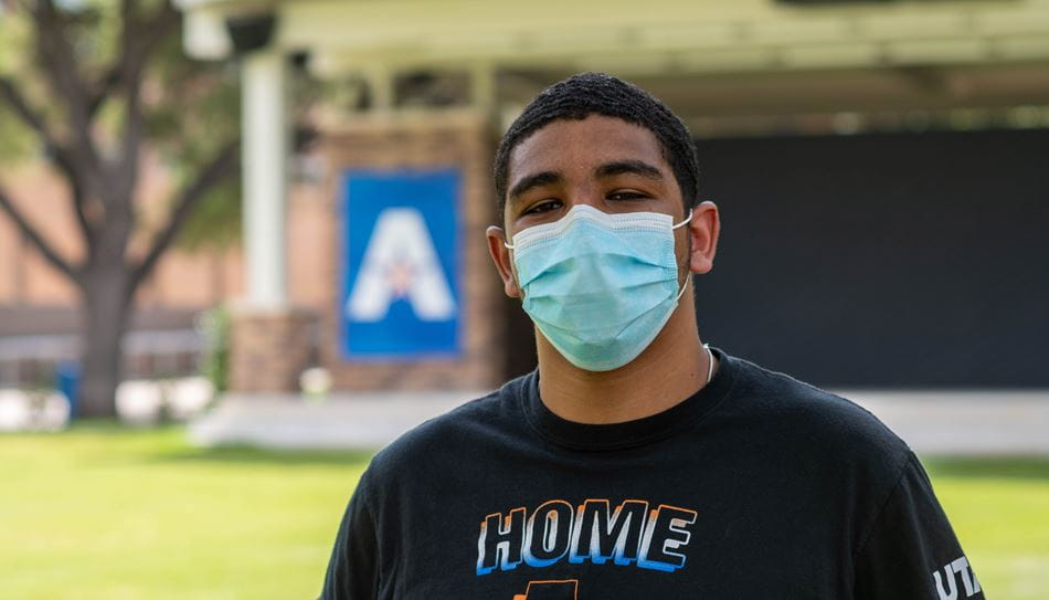 UTA Student outside with a mask on