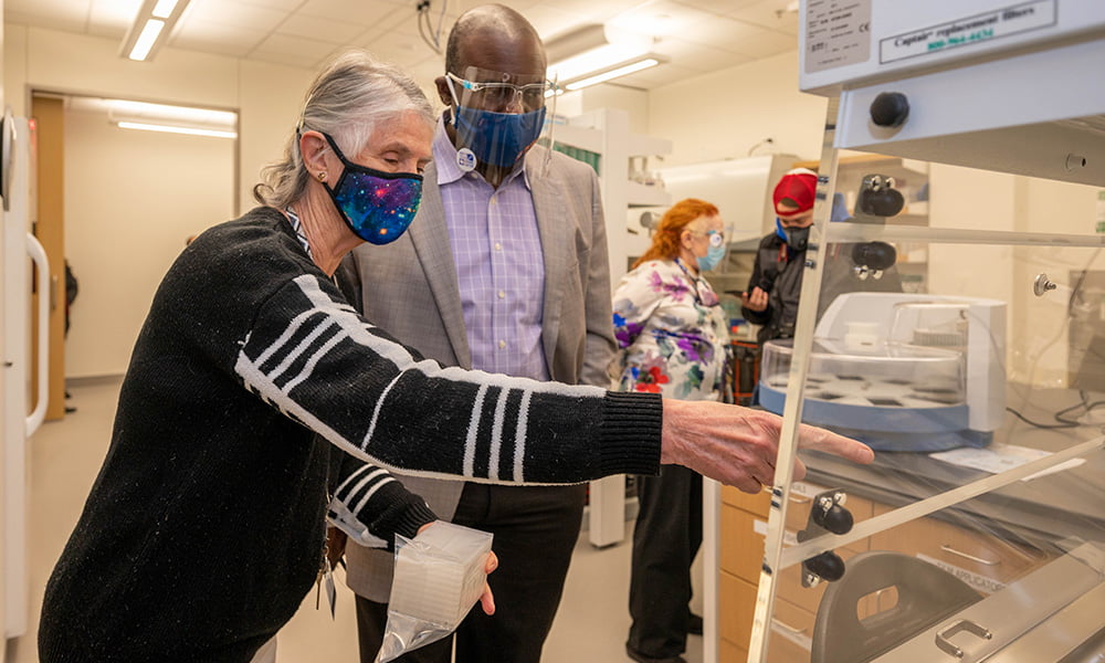 Anajane Smith (left) of the North Texas Genome Center with Archie Holmes." _languageinserted="true