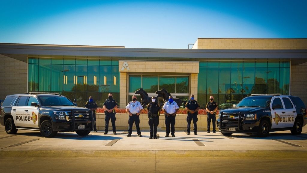 UTA police officers in front of University Center on UTA campus