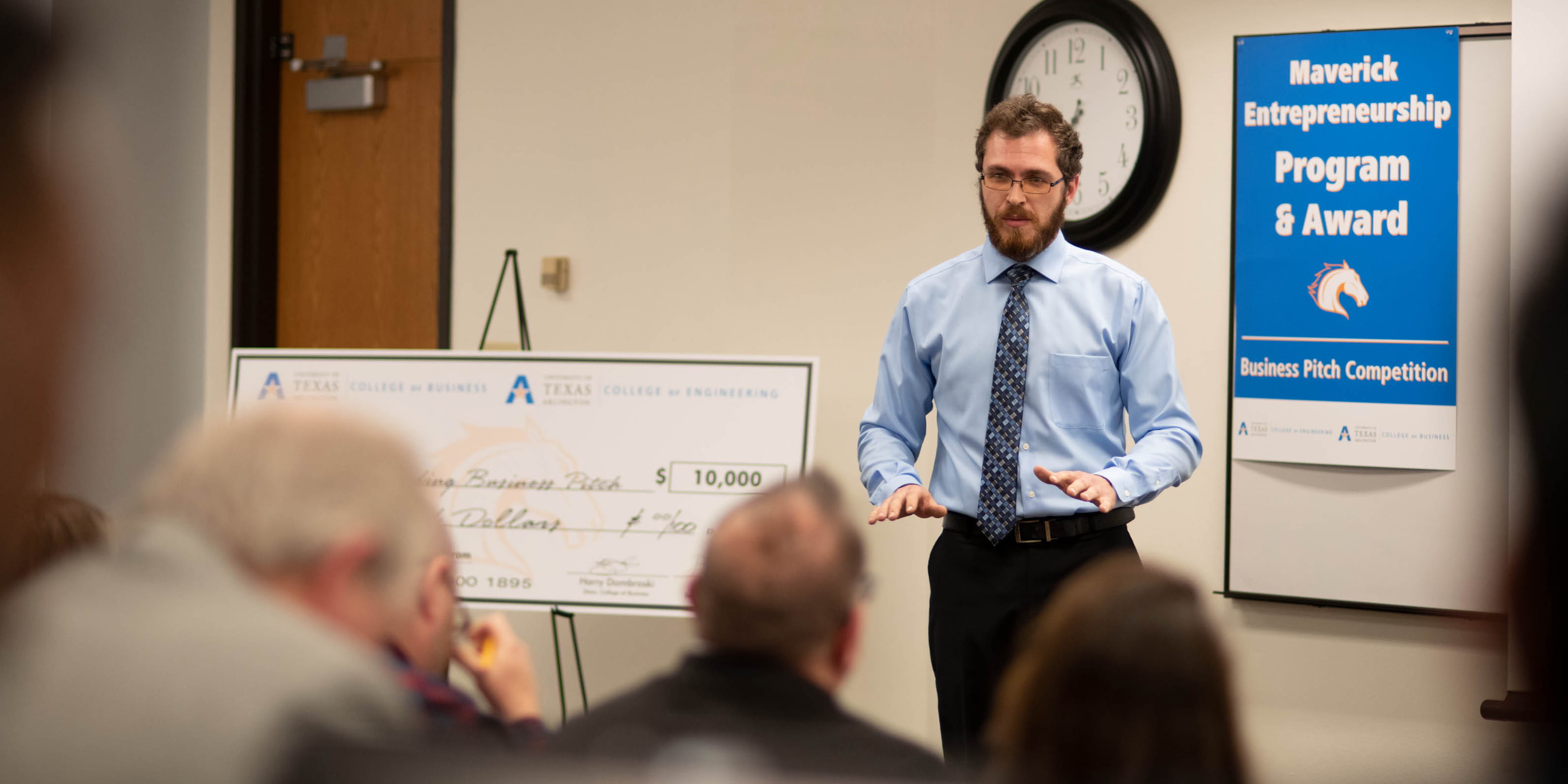 A student gives a presentation during MavPitch, a startup business competition." _languageinserted="true