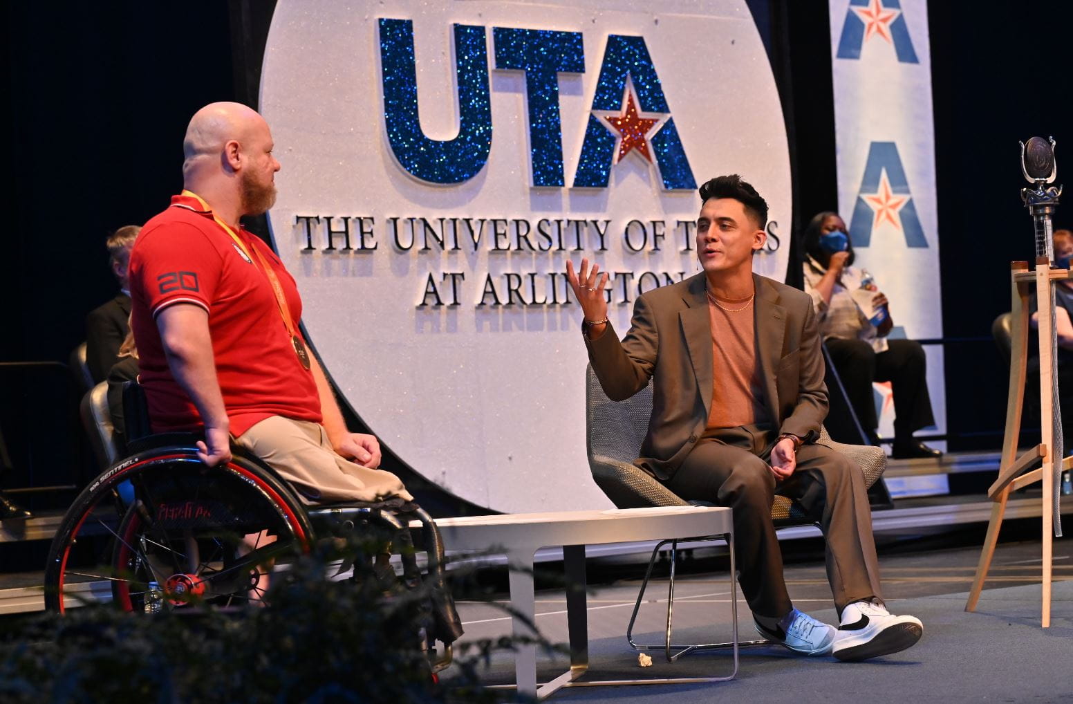 Fall 2021 Convocation Keynote speakers Aaron Gouge (’09 B.A., Kinesiology), left, a gold-medal-winning Paralympian, and Raul Solis (’12 B.A., Communication), an Emmy-winning Univision correspondent." _languageinserted="true