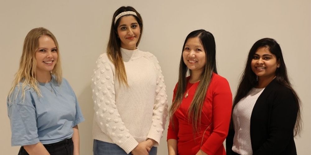 Hannah Affleck, Alina Choudry, Liao Yue and Mahima Pandya pose for group photo." _languageinserted="true