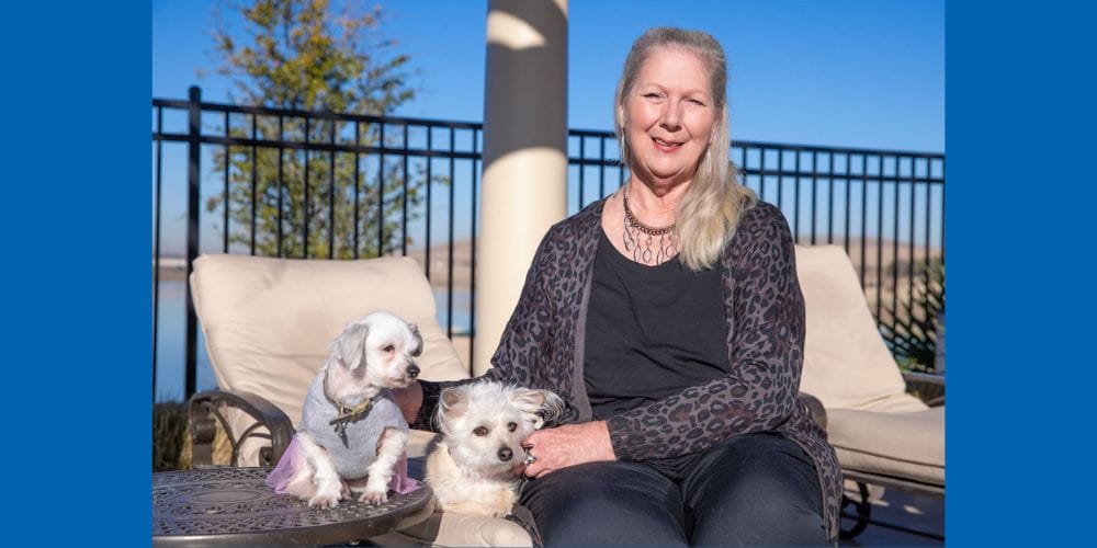 Jan Finch poses with her dogs Allie and Gia" _languageinserted="true