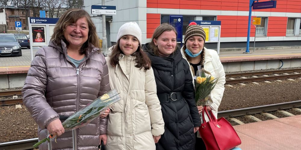 Olexandra Shevchenko pictured with her mother and cousins at a train station in Poland.