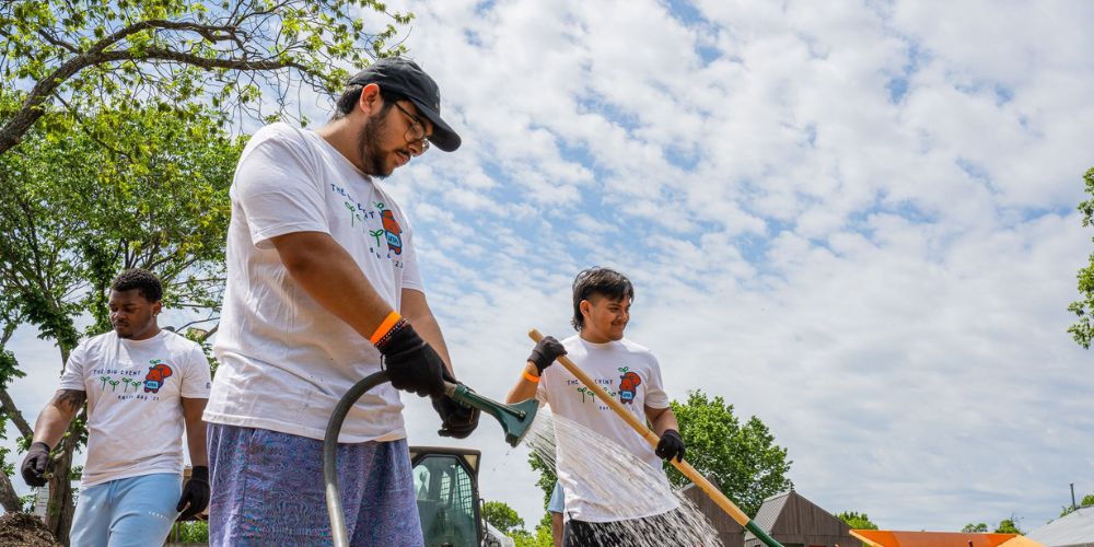 Three UTA students volunteering at one of The Big Event