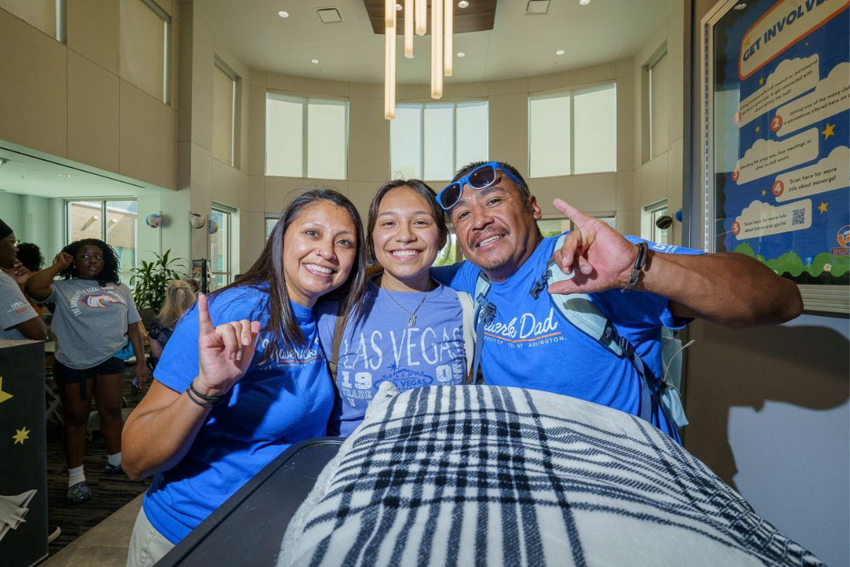 UTA student and her family inside West Hall