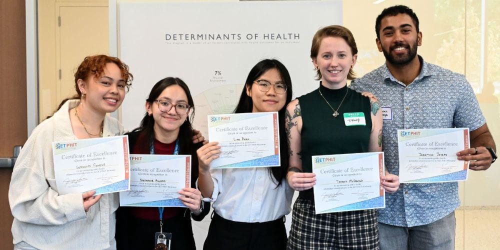 Group of UTA students who won the Get PHIT health informatics conference presentation competition pose for a photo." _languageinserted="true