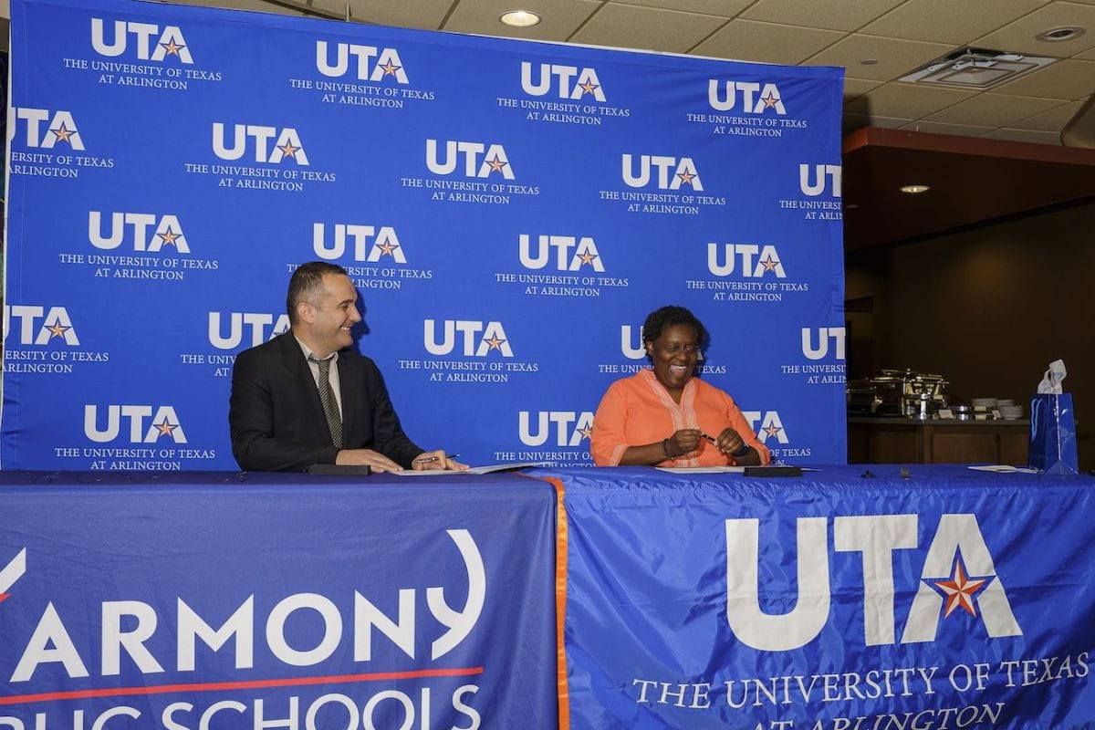 Umit Alpaslan, left, and Tamara L. Brown sign MOU marking partnership with Harmony Public Schools." _languageinserted="true