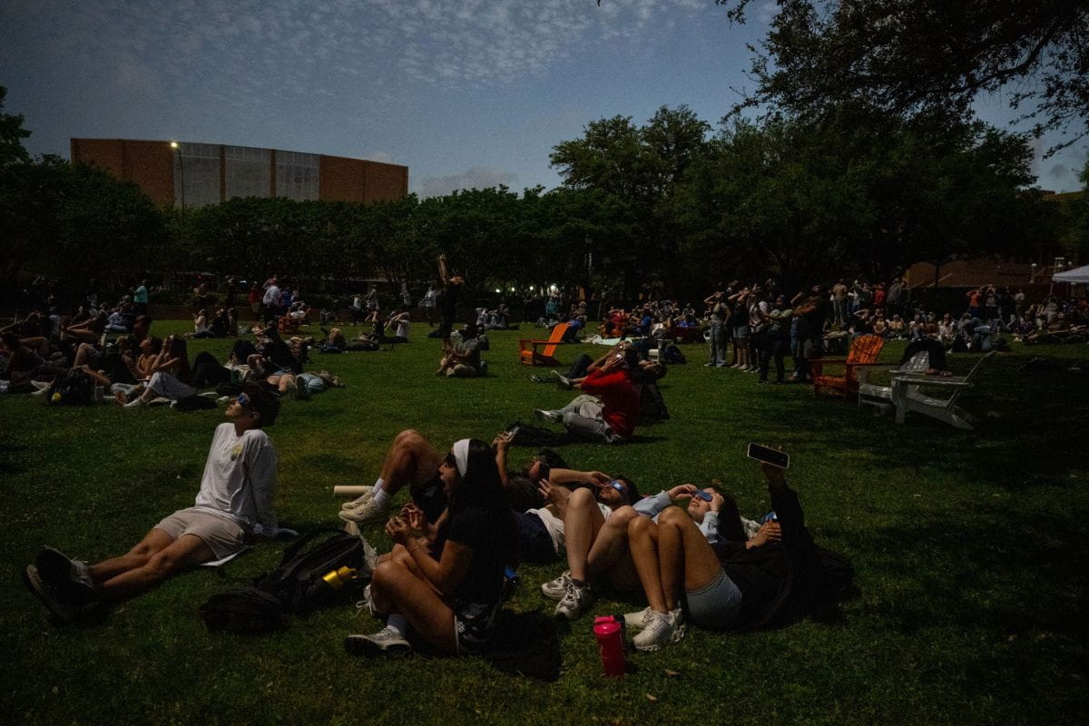 Members of UTA community look up at eclipse in Brazos Park