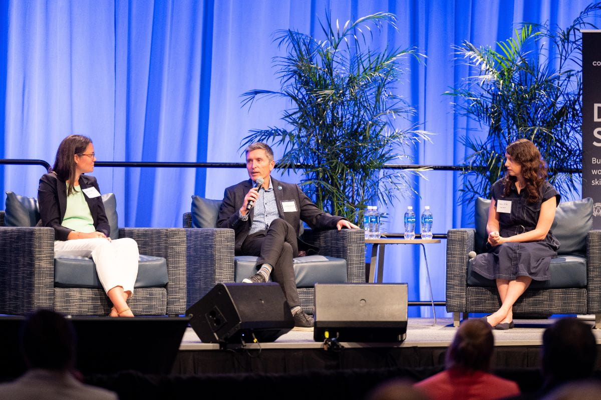 Photo of participants of DFW Summit speaking during a panel discussion
