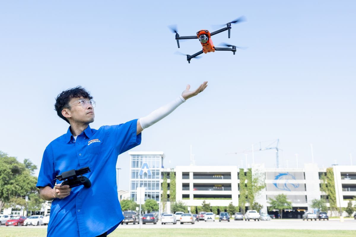 Professor Zhe Yin operates a drone