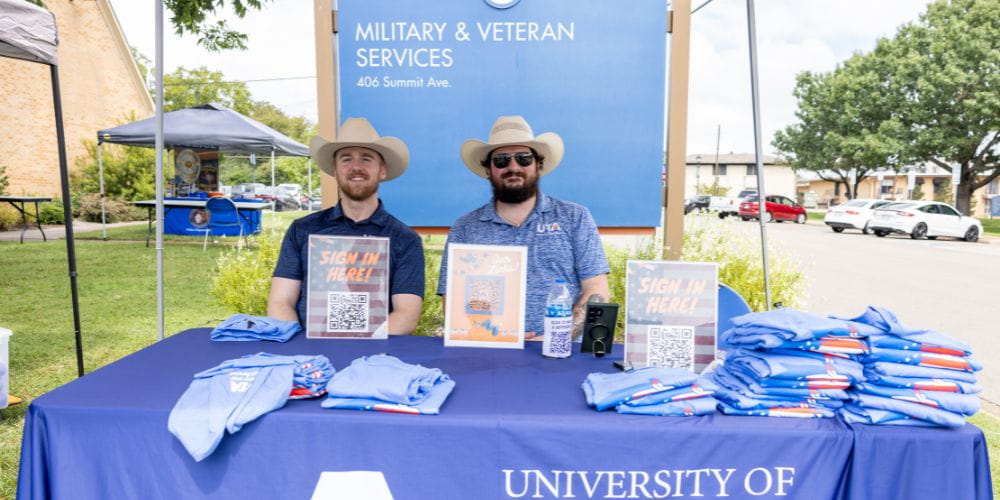 Photo of smiling UTA students at 2024 Veteran Resource Fair" _languageinserted="true