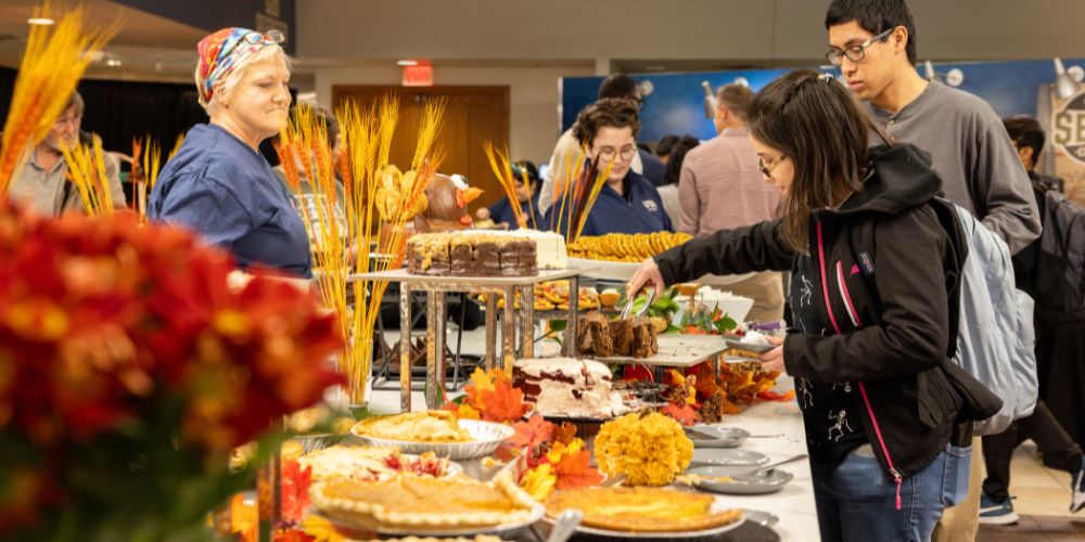 Students go through the desert line at the annual Thanksgiving Dinner at UTA