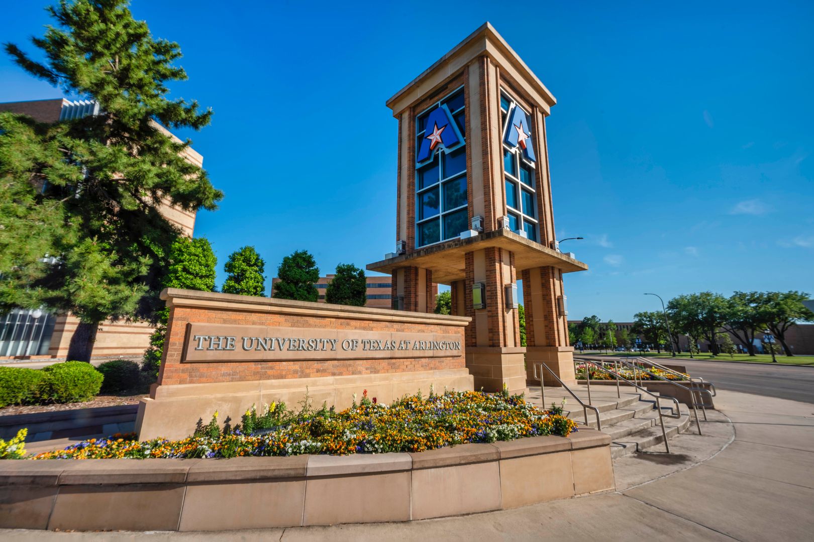 Image shows a photo of the UT-Arlington tower 