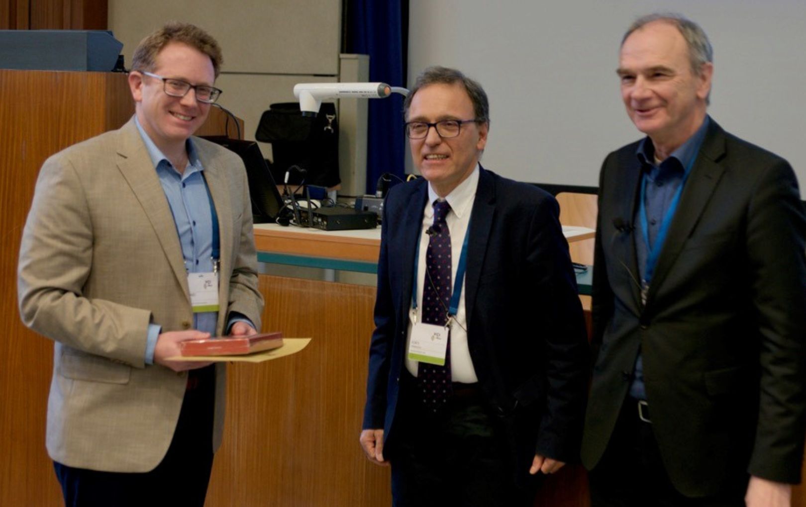 University of Texas at Arlington physicist Ben Jones has received an international honor for his contributions to developing advanced instruments used in particle physics research