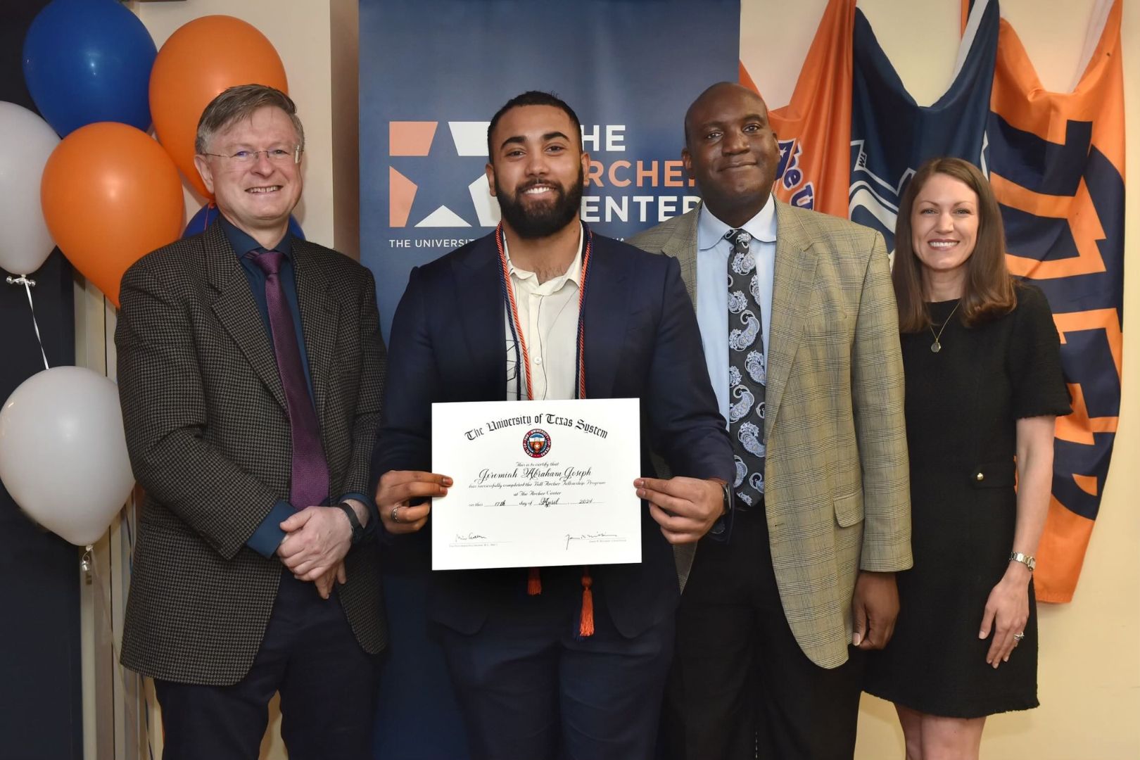 Image shows Jeremiah Joseph receiving his scholarship 