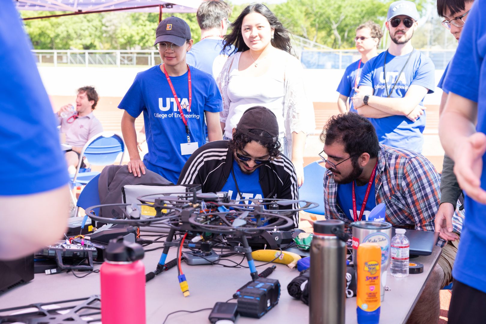 Image shows UTA students working on their drone