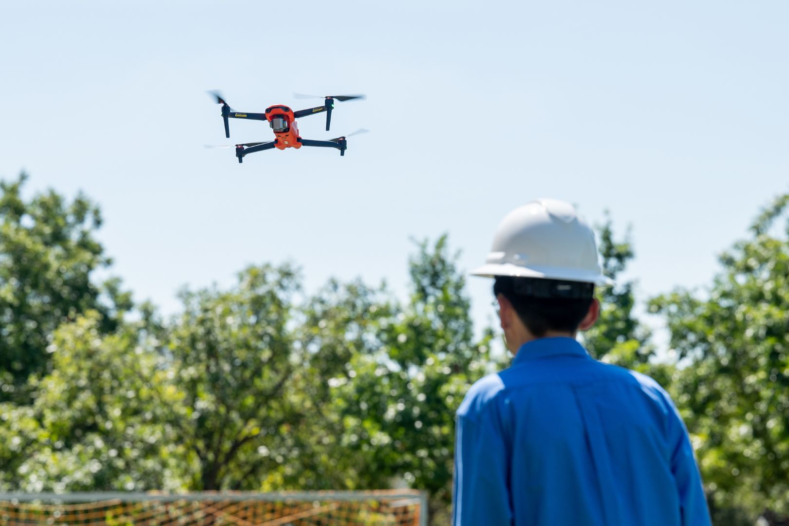 Image shows a man operating an aerial drone at UTA