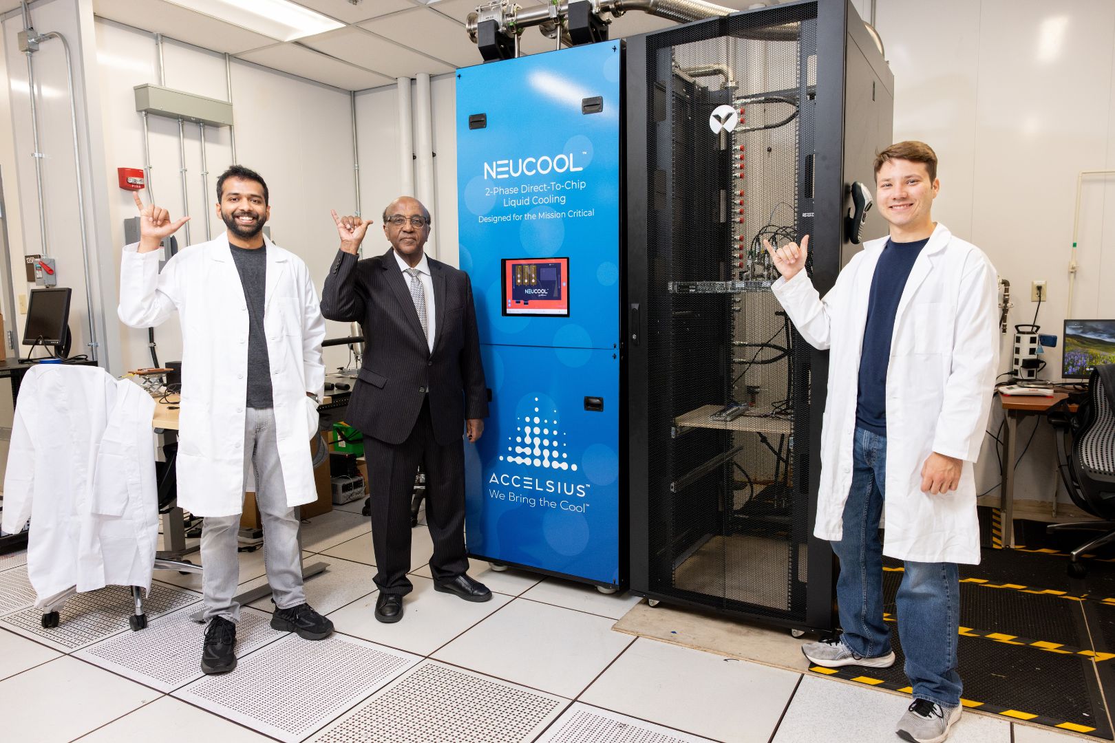 Image shows Dr. Dereje Agonafer and his students in their lab 