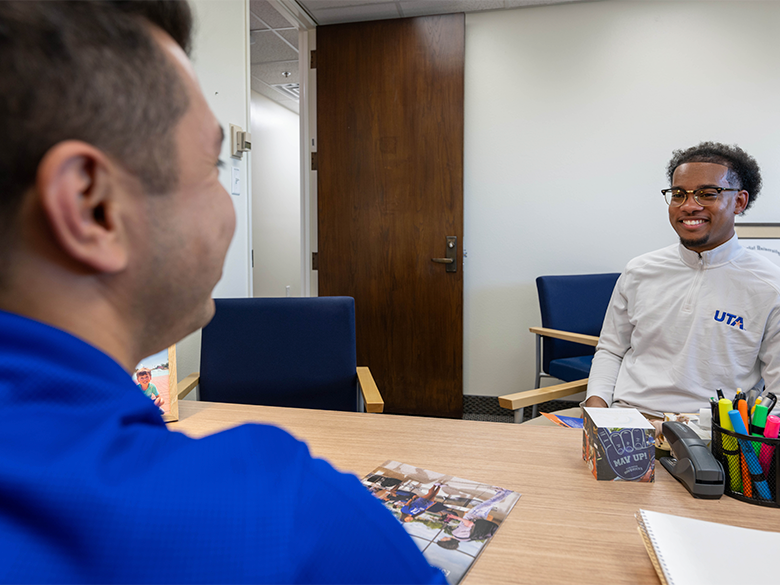 Two men talking in an office