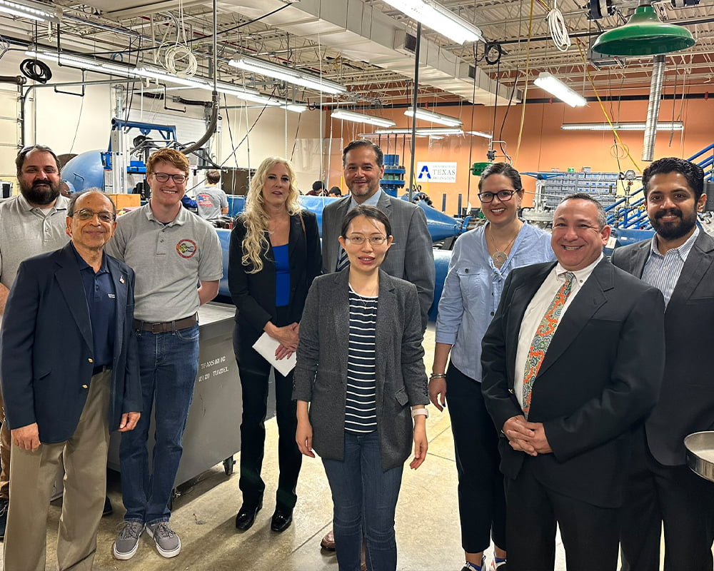 President Cowley with Mav engineers at the Aerodynamics Research Center