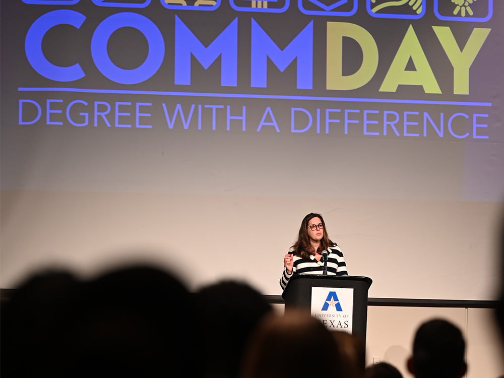 Jennifer Cowley speaking to crowd at Comm Day