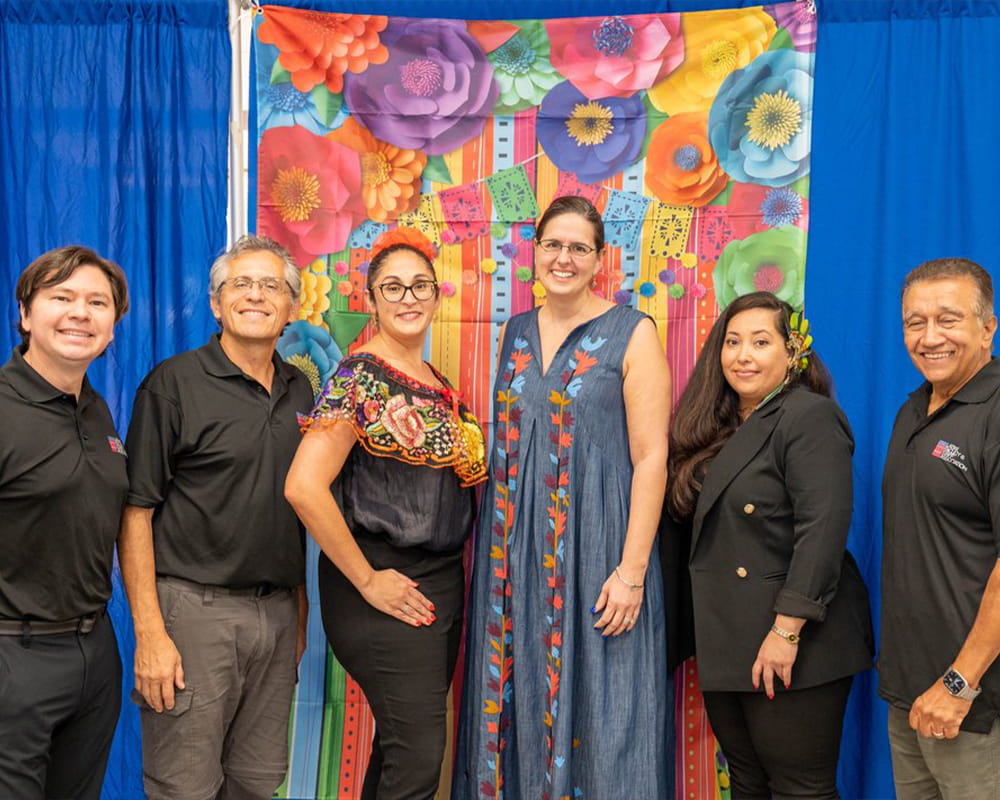 President Cowley poses with Latinx Faculty and Staff Association