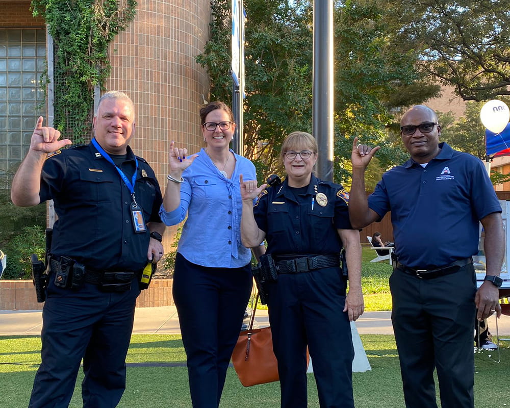 President Cowley and Officers doing Mavs Up gesture