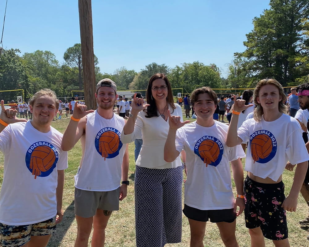 President Cowley with students Oozeball event