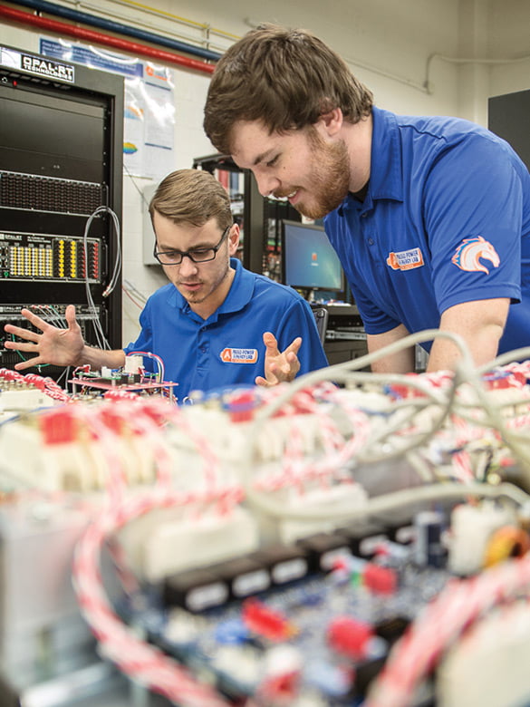 Two students working on electrical project