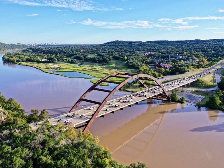 A bridge runs over water outside of Austin, Texas.