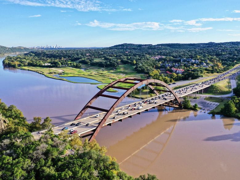 A bridge runs over water outside of Austin, Texas.