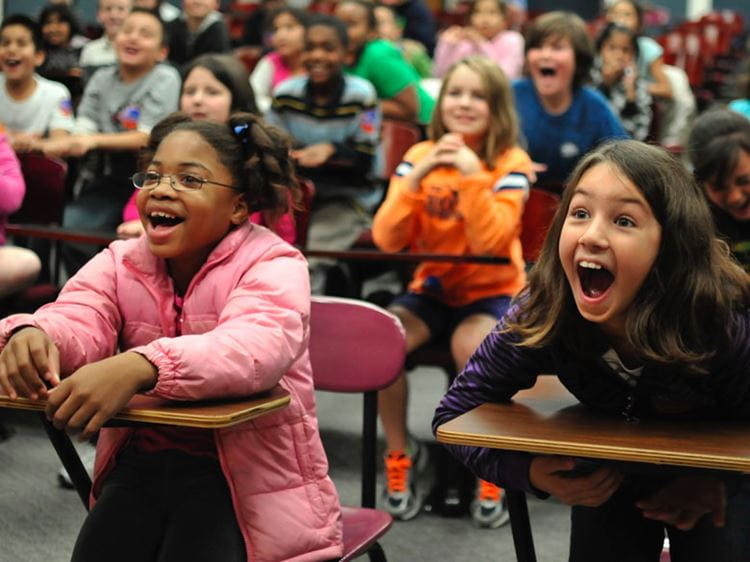 Students react in amazement during a Science Ambassadors show.