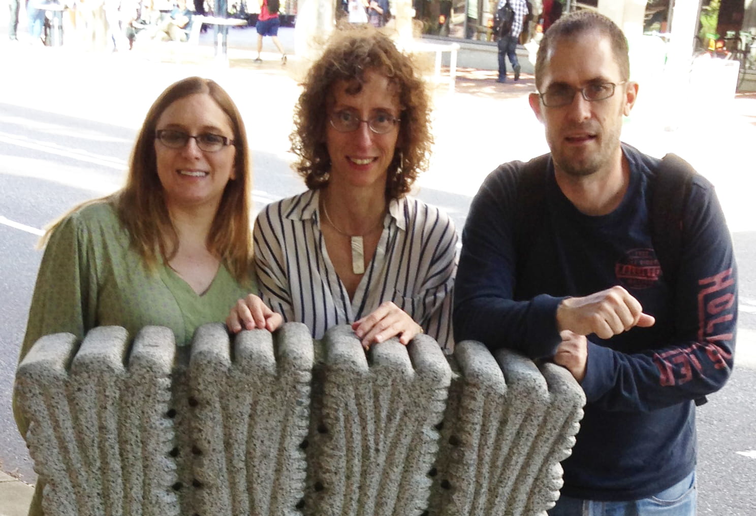 Photo showing Katrina Pound, Sophia Passy, and Chad Larson, from left, with a diatom statue in Portland, Oregon. Diatoms are one of the subjects of the trio’s recent publication. 