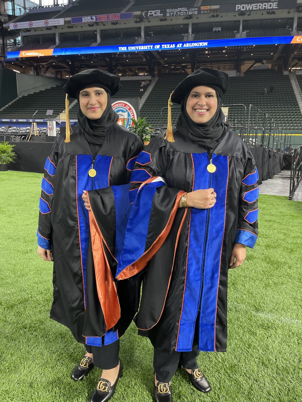 Hanof Alkhaldi, left, and Noura Alkhaldi at the Fall 2021 COS Commencement ceremony.