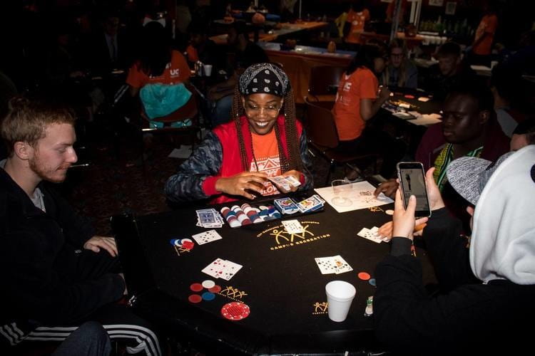 Participants of  Halloween Casino Night enjoying a game of poker