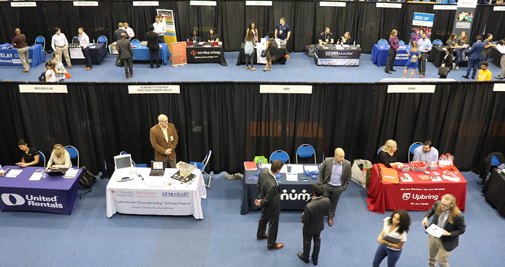 job fair pic with tables and people