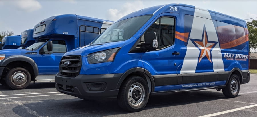 Image of a van and a bus with UTA logo. 