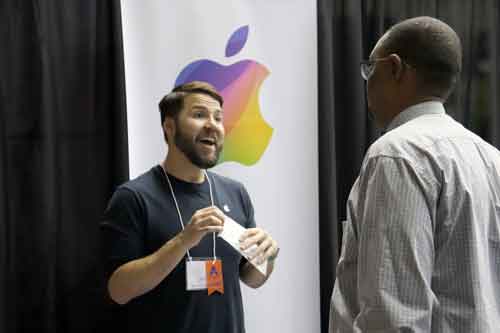 Apple representative talking to student