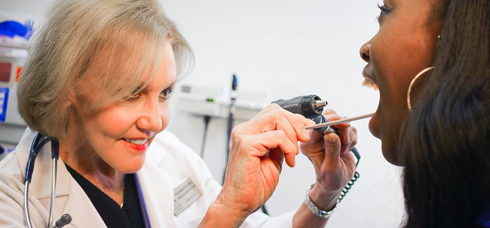 A patient getting a laryngoscopy examination