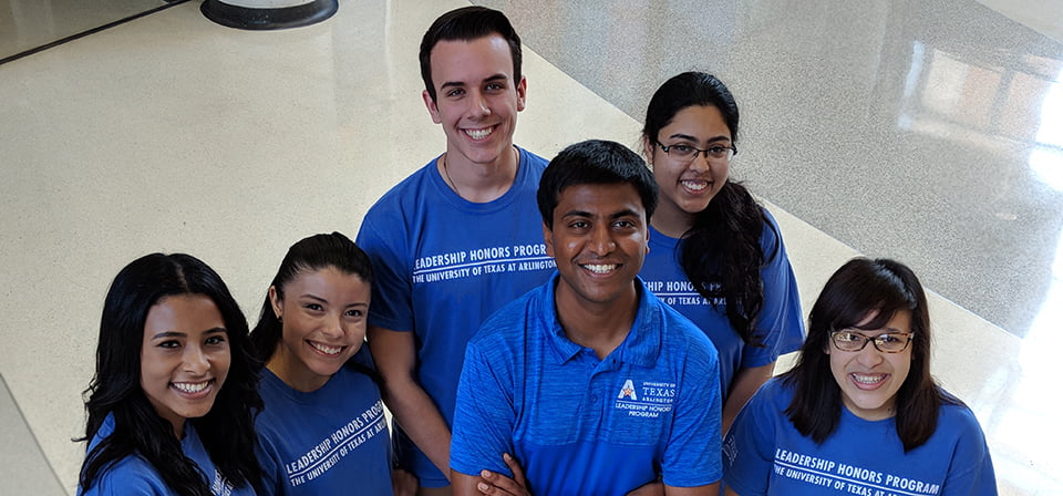 Leadership honors students posing at camera and smiling