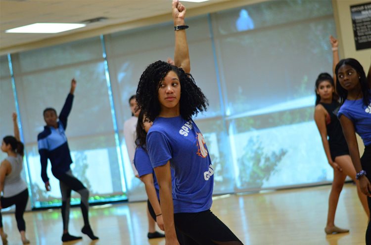 UTA dance team practicing at cheer camp for college students