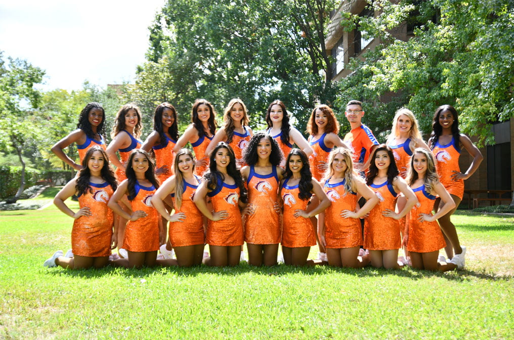 UTA Dance Team 2019 outside in front of trees