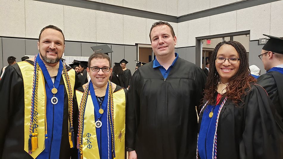 Group of people in graduation gowns