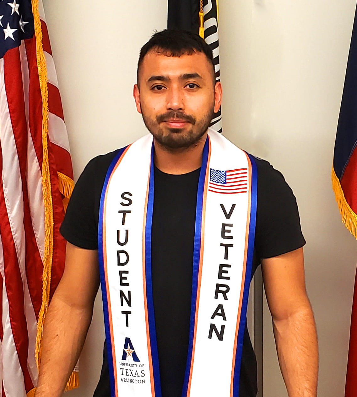 Student wearing a graduation stole that says "Student Veteran" on it. 